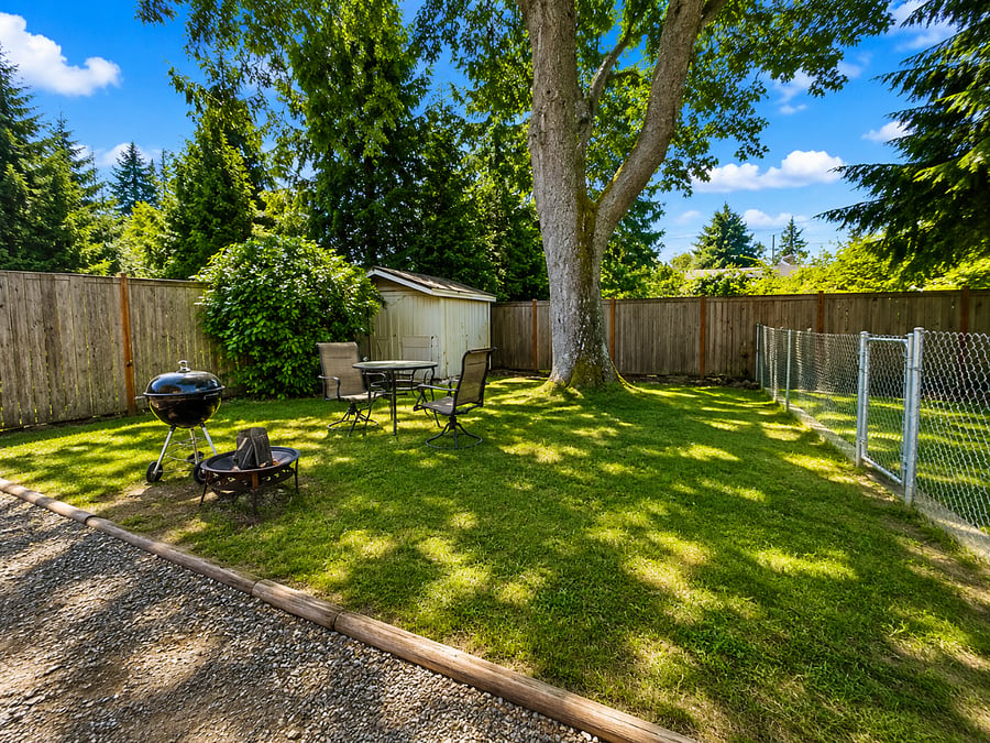 Large, Fully Fenced Backyard with Patio Dining Set, Fire Pit, BBQ Grill & Spacious Storage Shed