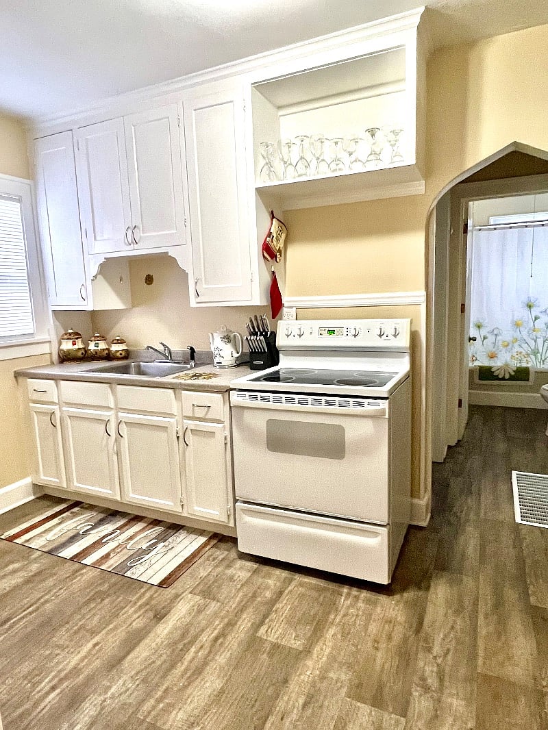 Kitchen with electric stove/oven & full size refrigerator 