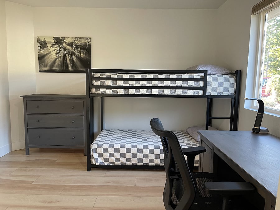 3rd bedroom with twin bunk beds and dedicated work space