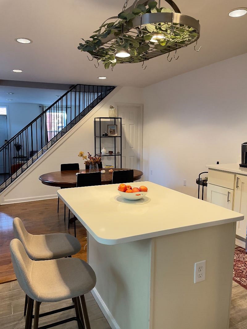 island has an outlet to connect appliances, and the side door is to the basement for storage purposes