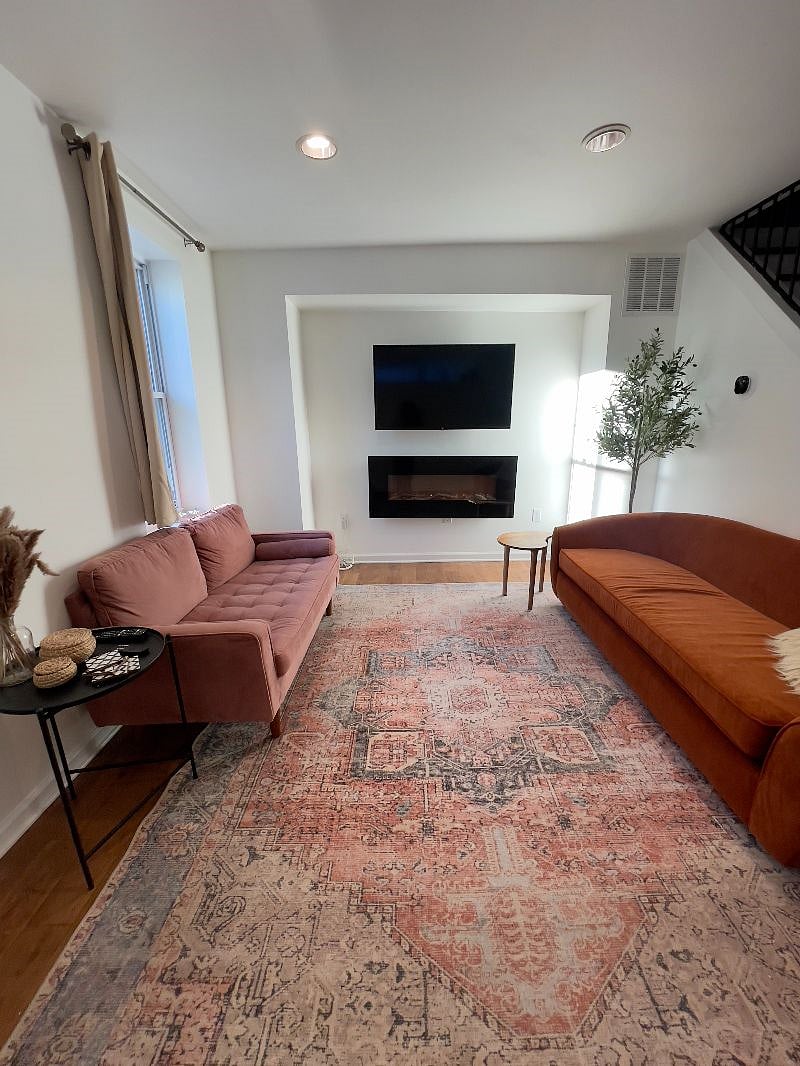 living room space featuring a smart tv and an electric fireplace