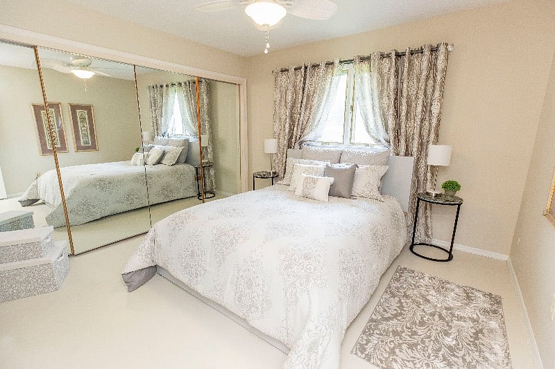 Bedroom 2, new queen bed, beautiful new bedding, curtains, floors & paint, drawers, large wall length closet Mirrored across 1 wall. TV. Gorgeous.