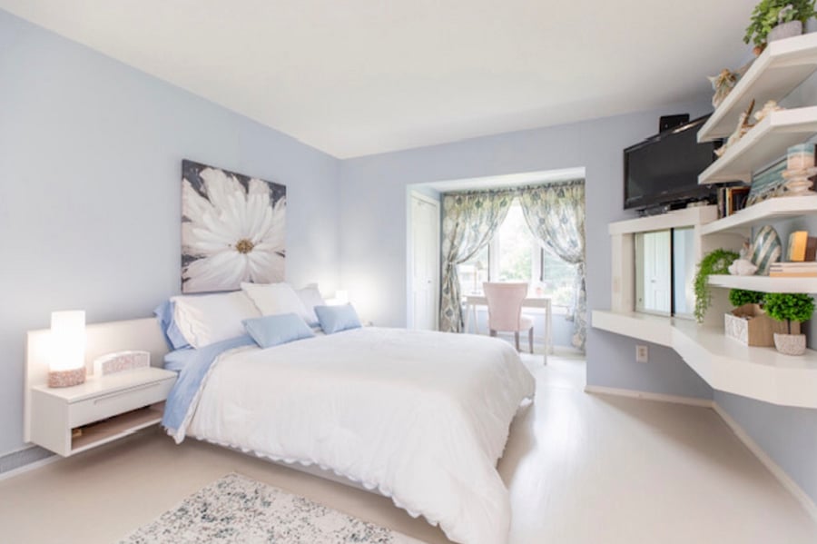 Primary suite. Queen bed, fresh linens, beautiful drapes and rugs, TV, desk & chair, love seat. Large closet and two chests of drawers.