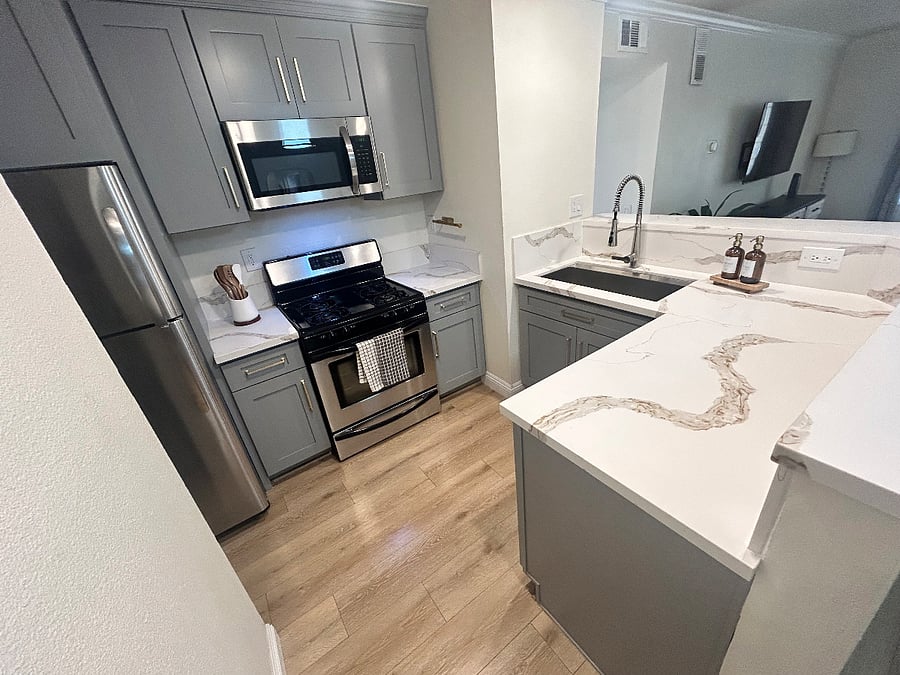 Kitchen | Fully remodeled kitchen with modern finishes and full-size appliances.