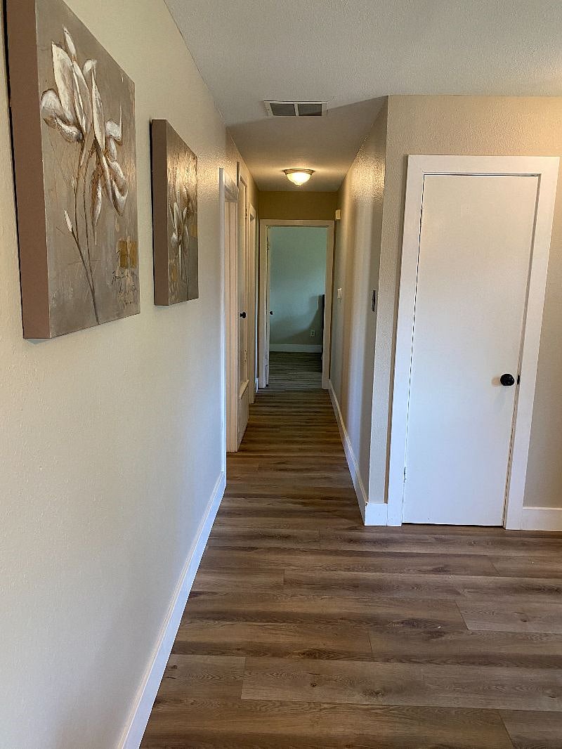 Hall leading to master, the smaller bedroom, and 2nd bath
