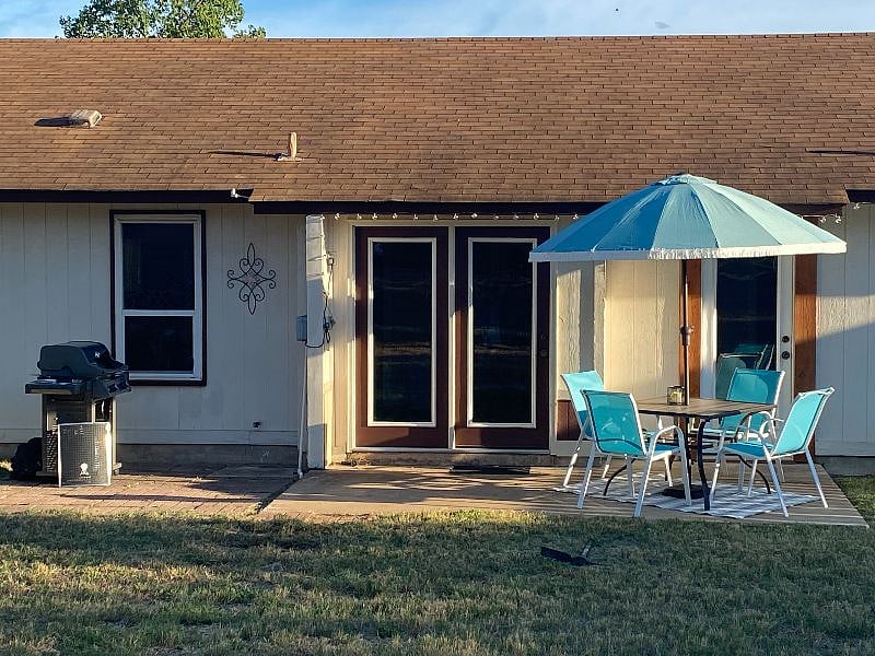 Patio doors lead into the dining area. The door to the right of them leads into the laundry room.