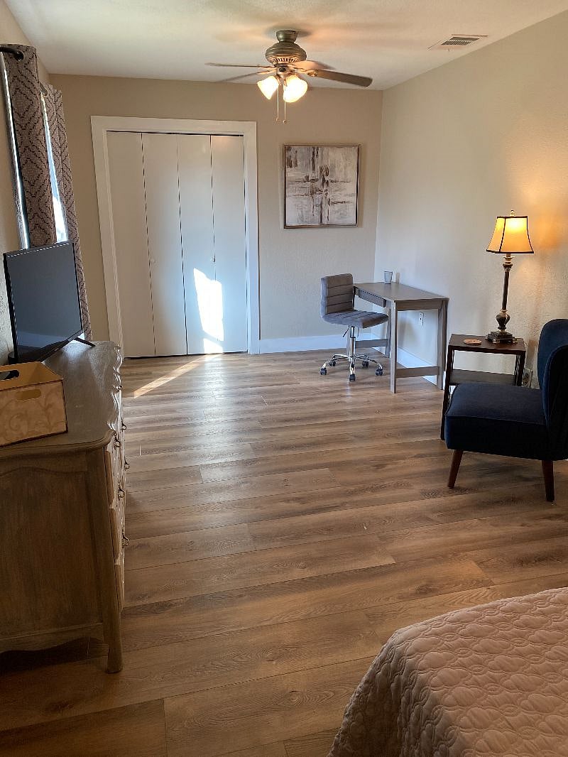 Master bedroom sitting and working area, plus closet