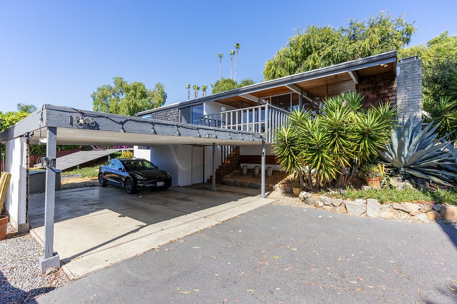 Carport with Tesla that can be rented with a week minimum rental through Turo. Charging is available at the house
