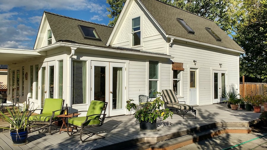Sunny, south-facing deck runs the entire length of the home.