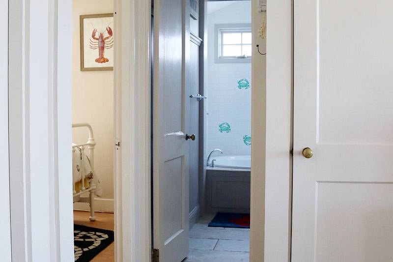 Main level master bedroom on left and bathroom straight ahead. Door on right is a utility closet.