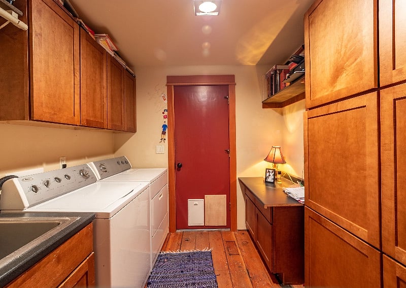 Laundry Room with Washer, Dryer, Stainless Steele Laundry sink and drying rack for delicates and hand washing.
