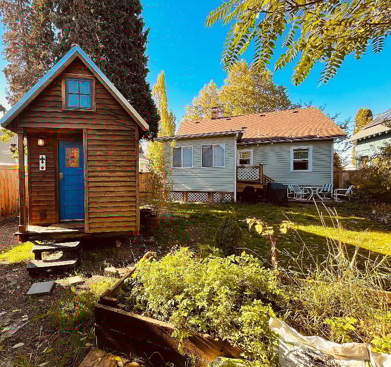 100 square foot tiny house in the yard shared with the main house