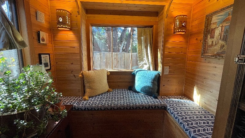 Reading nook with storage benches and a picture window.