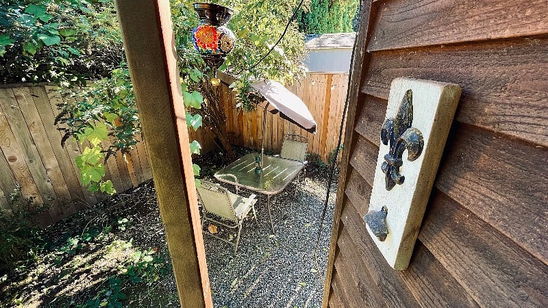The view of the table and chairs from the front porch of the tiny house.