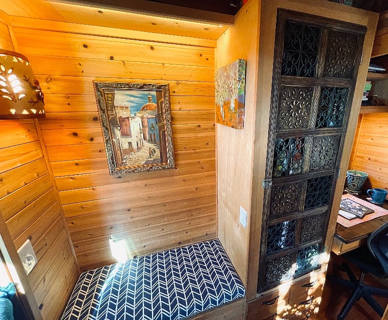 Smaller storage bench and closet with drawers below.