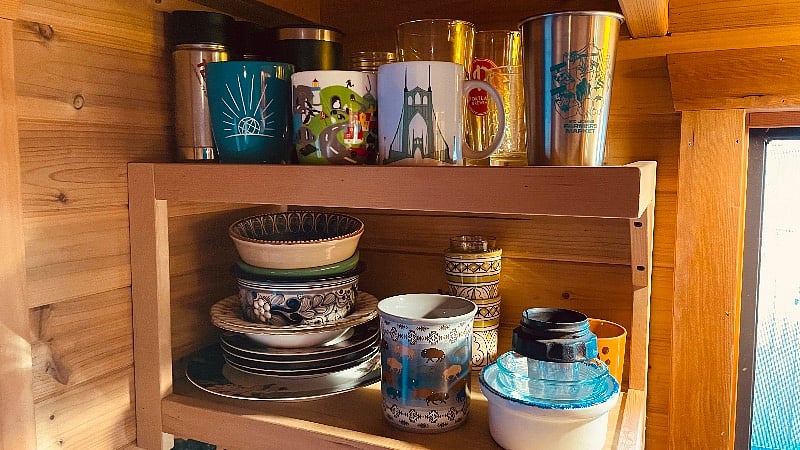 Two shelves for dishes. We can pack up our most sentimental items and leave the rest for you to use or we can pack them all away.