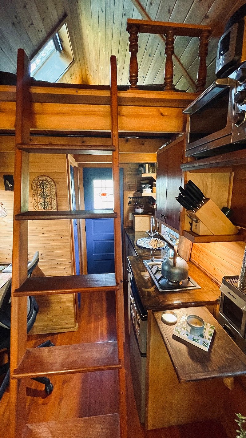Showing the ladder that is used to get to the sleeping loft.