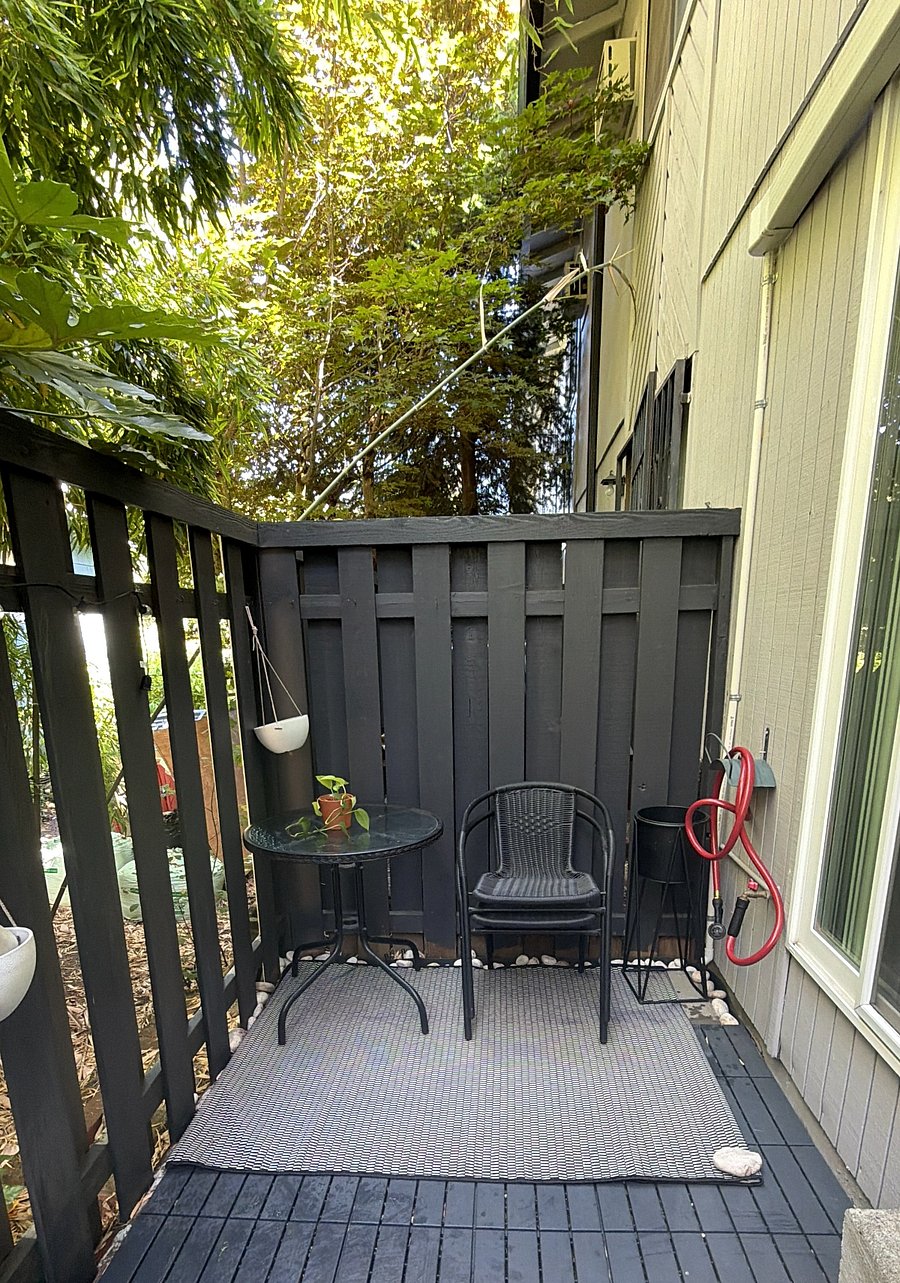 Back patio- perfect place to read, relax, or toss open the grill.