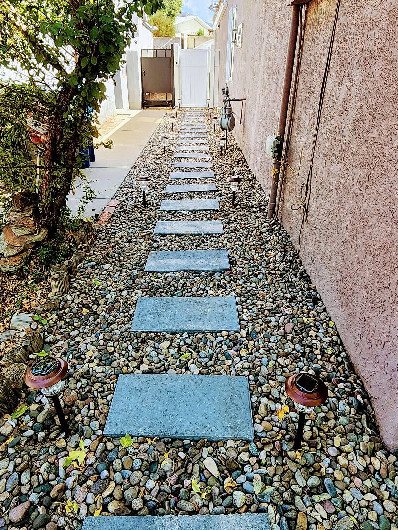 Side entry to backyard. Lit walkway. Gate has a secure entry lock.