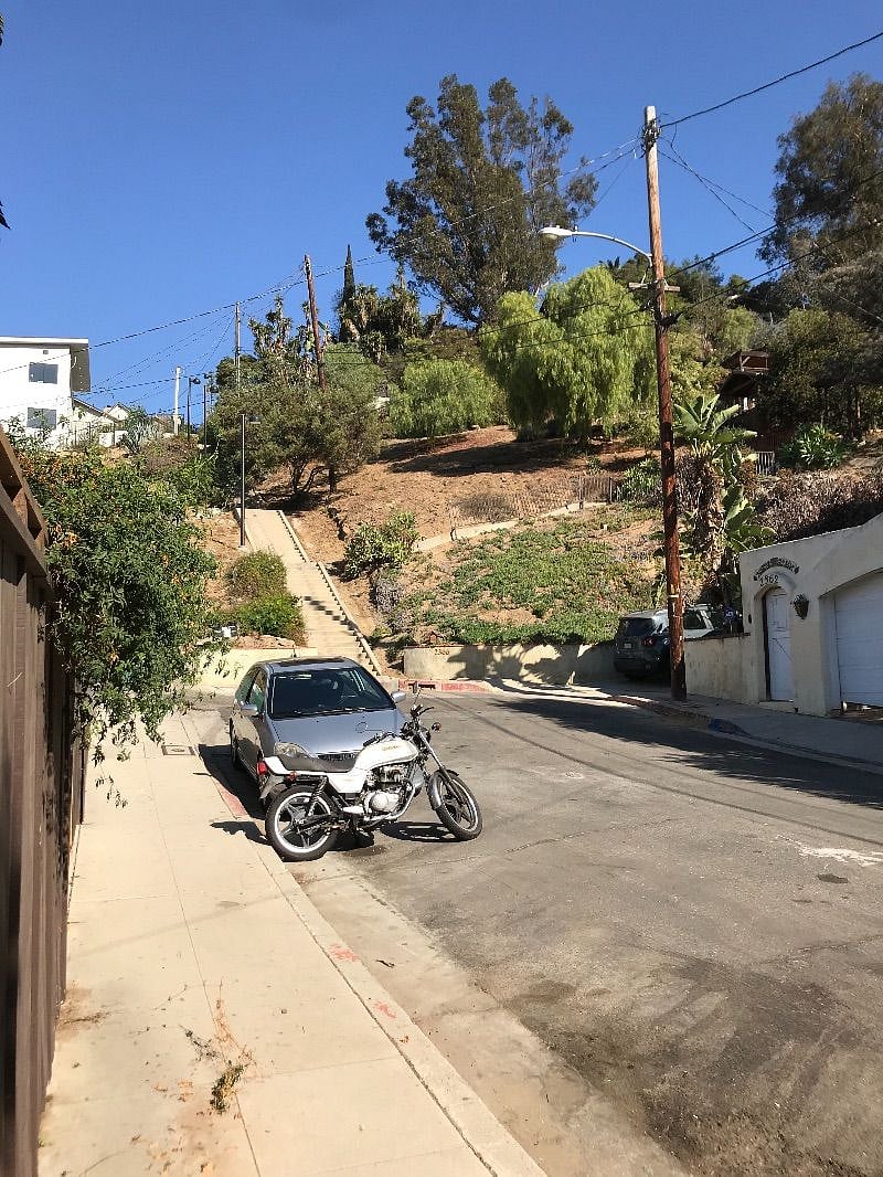 The house faces Peru street .. which a delightful dead end with the famous Echo park stair master