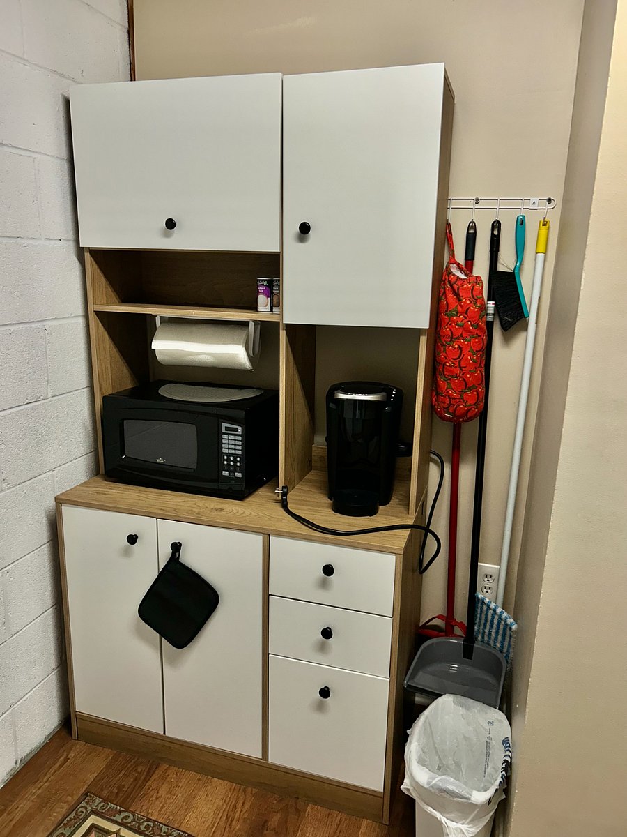 Kitchenette: microwave, coffee, toaster broiler oven, utensils, trash can