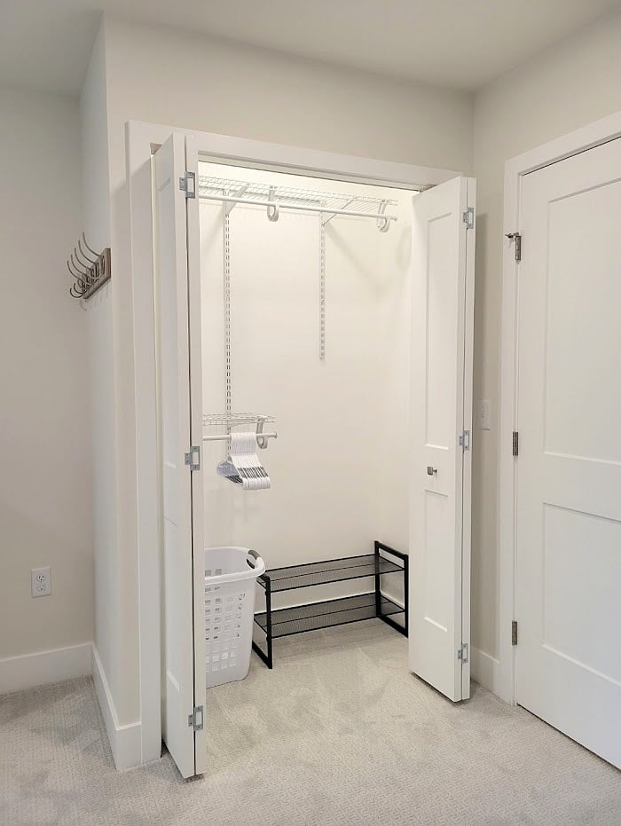 Bedroom 1 - Brightly lit closet and wall hooks 