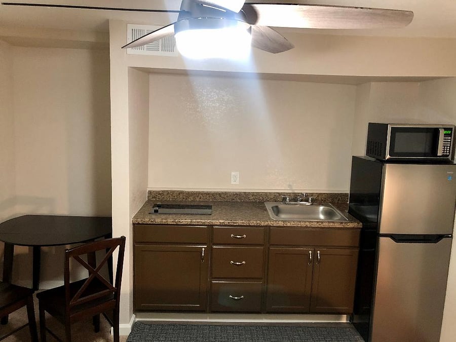 Kitchenette inside with freezer/refrigerator, microwave and electric stove