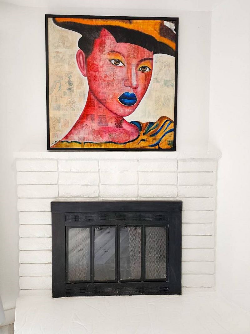 Living room fireplace with original Thai artwork!