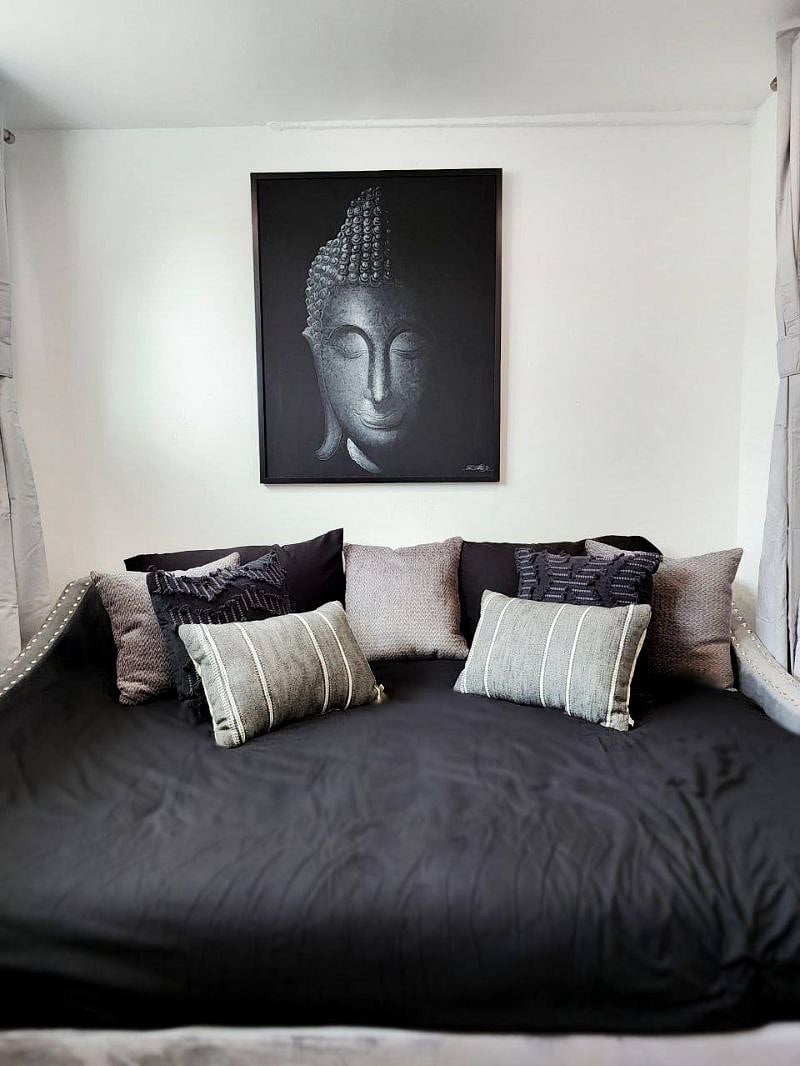 Downstairs bedroom with Large Full day bed and pull-out twin bed, original Thai artwork, room darkening shades, private exterior entrance, and 4k smart TV!