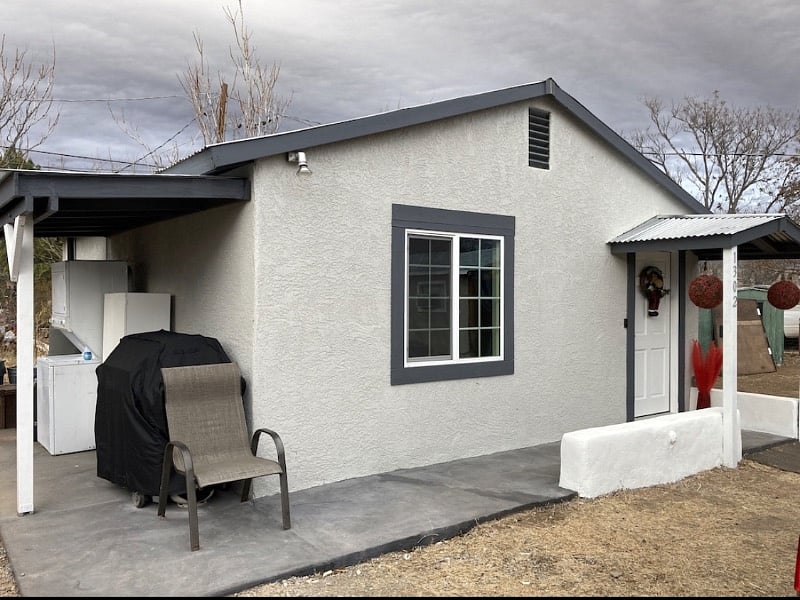 Exterior of one bed and front area seating. Grill is for your use and the washer and dryer as well. 