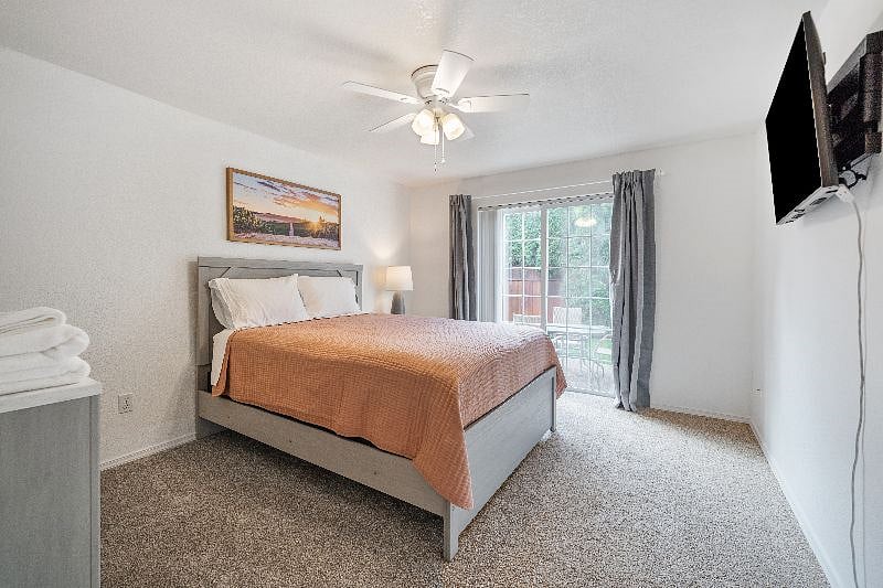 Bedroom 1 with queen bed and smart TV