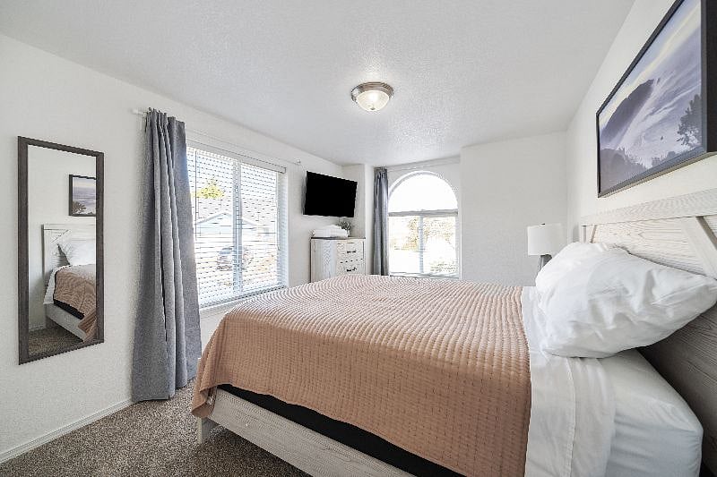 Bedroom 2 with queen bed and smart TV