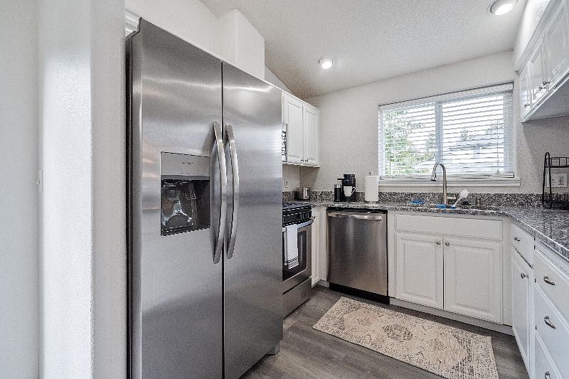 Kitchen with new, full size appliances.