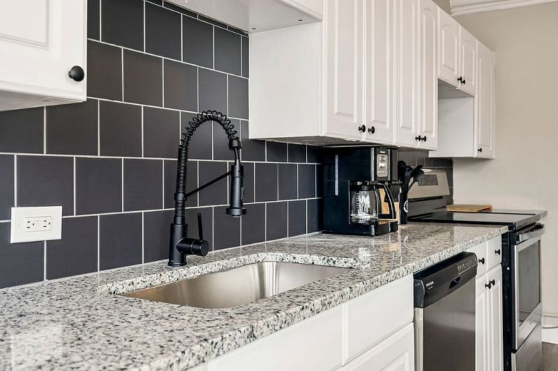 The kitchen is well appointed with all necessary flatware, cutlery and utensils, as well as pots, pans, bowls, rice cooker and coffee pot. 