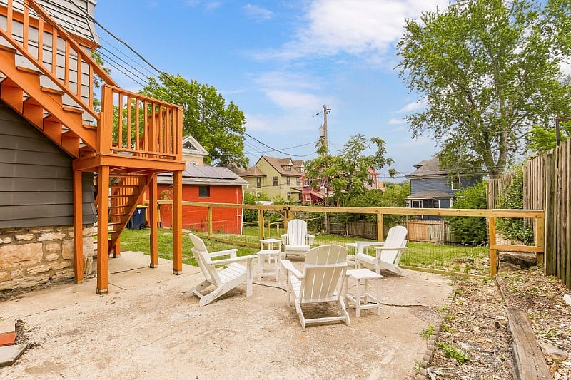 There is a sitting area behind the building and adjacent to the fenced yard. This is available to all guests of the triplex. 