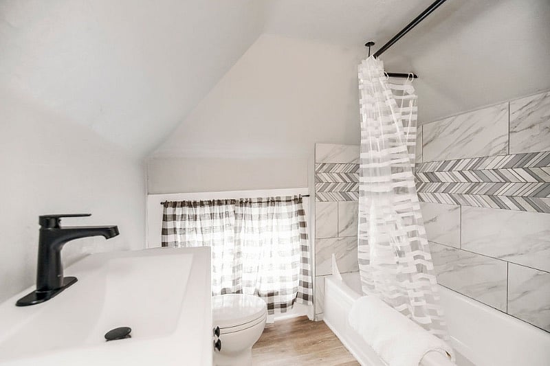 The bathroom completes the space, and now includes a combination washer/dryer. 