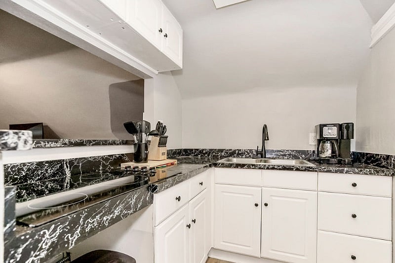 While the unit does not have a conventional oven, a microwave/convection oven has been added. 