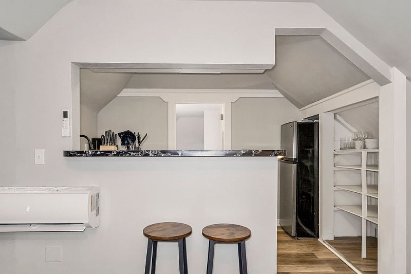 The kitchenette is adjacent to the living and sleeping spaces. 