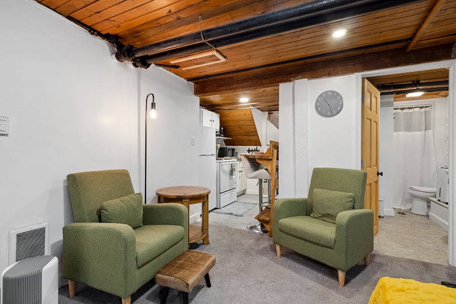 Sitting space, with slightly lower, cozy wood paneled ceiling