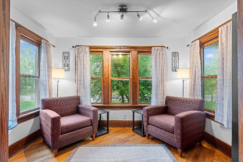 Sunroom. Globe is a bar with glasses in it.