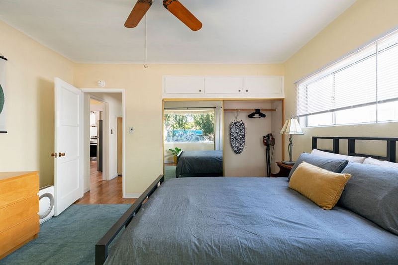 Bedroom with large closet and built in cabinets