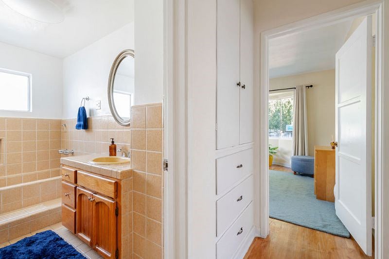 Built-in cabinets in the hallway between bedroom and bathroom