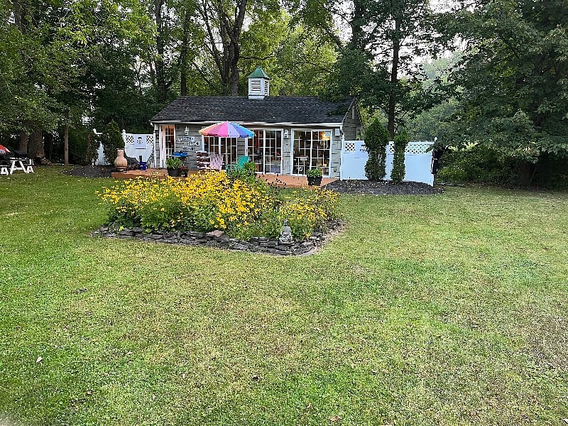 My husband's mancave. It's his office and kitchen too. He's always cooking extra so he can offer it to you. 