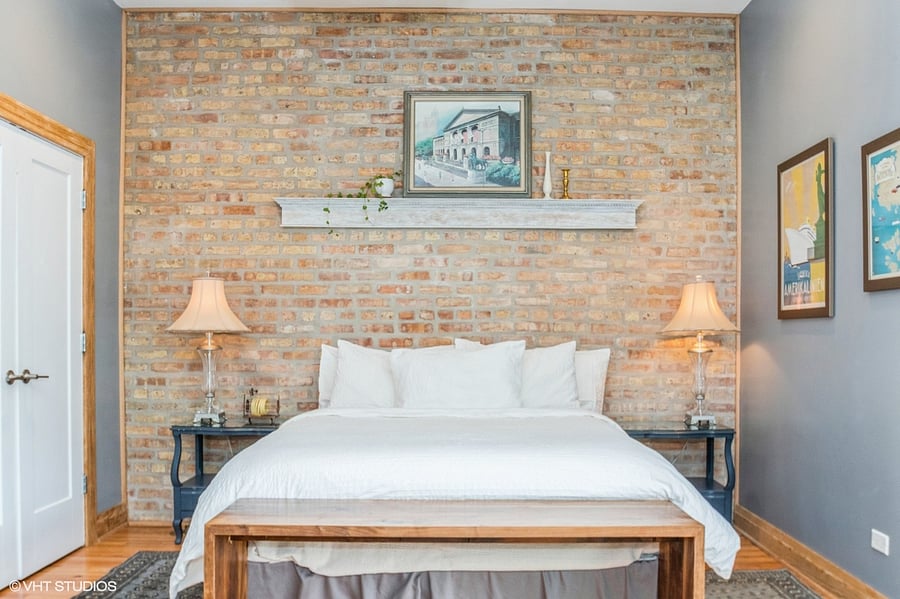 Master bedroom with queen bed and side tables.