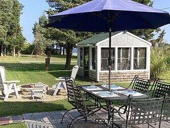 Outdoor firepit and screened in "She Shed".  