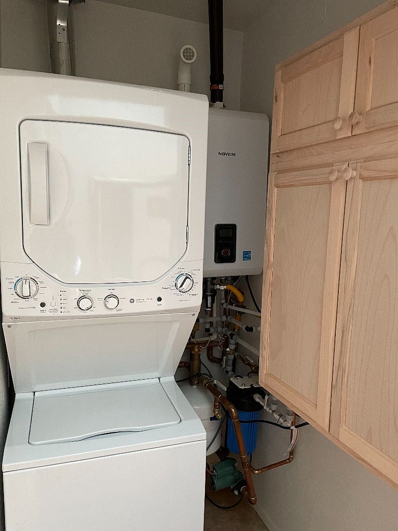 laundry closet with full size stackable washer/dryer