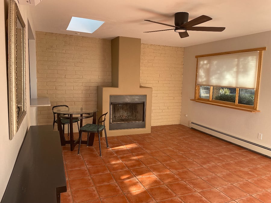 Living room with panoramic windows and skylight.
Notice: tile flooring throughout 