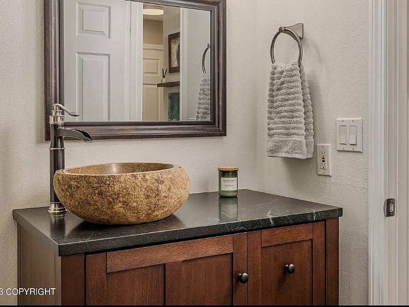Contemporary sink and soapstone vanity top.
