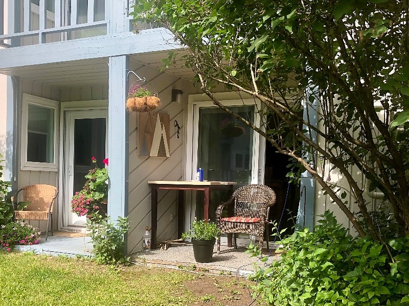 Here's is your small covered back porch. And the next door condo owner is a pilot who comes and goes, and is a terrific neighbor.