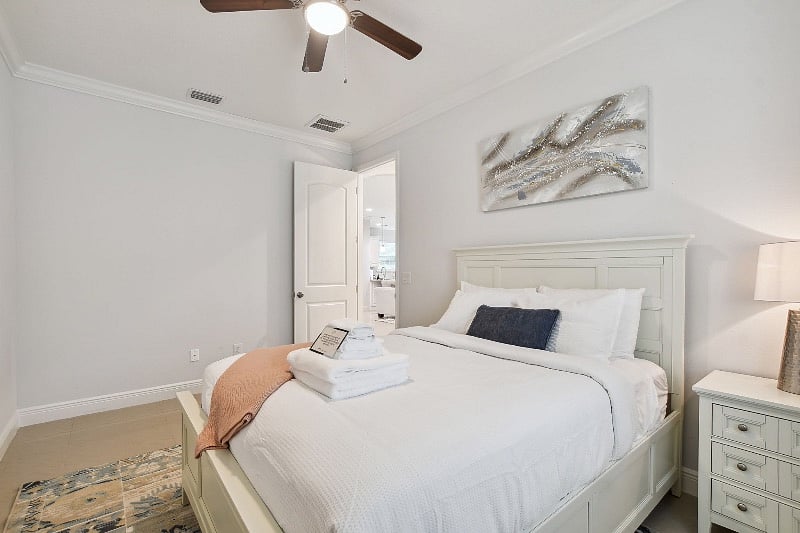 Guest bedroom 2 with queen sized bed and closet with hangers available. 
